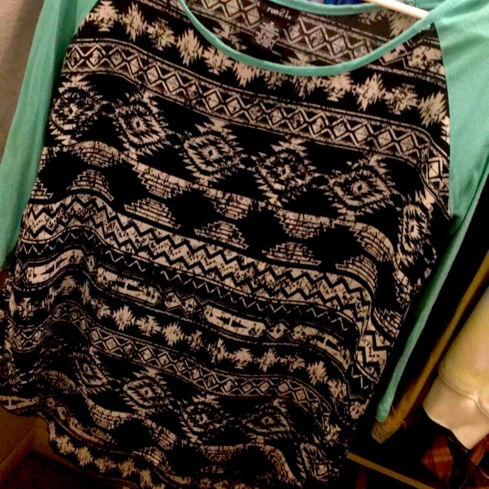 Quarter sleeve. Longer in the back. Medium